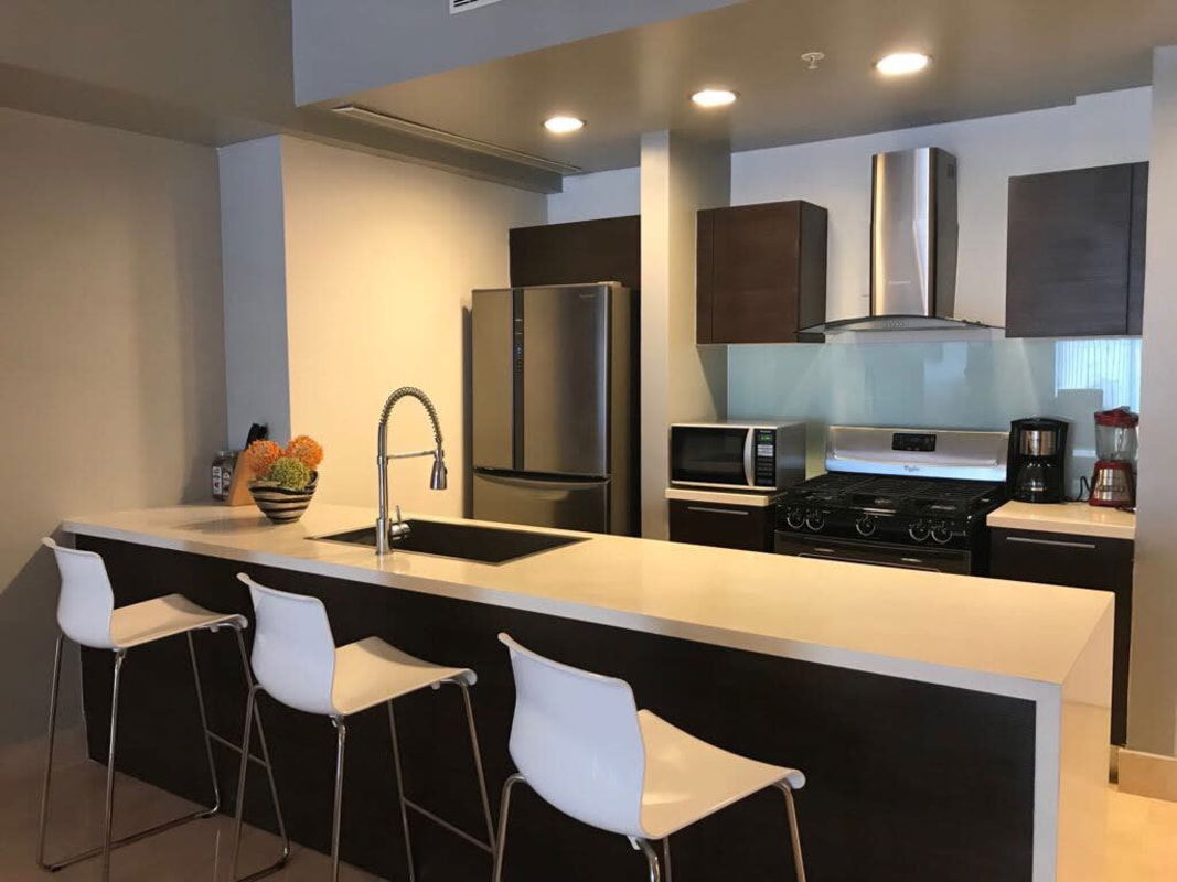 Modern dining area with marble table and designer furniture in PH Arts & Yoo Panama City