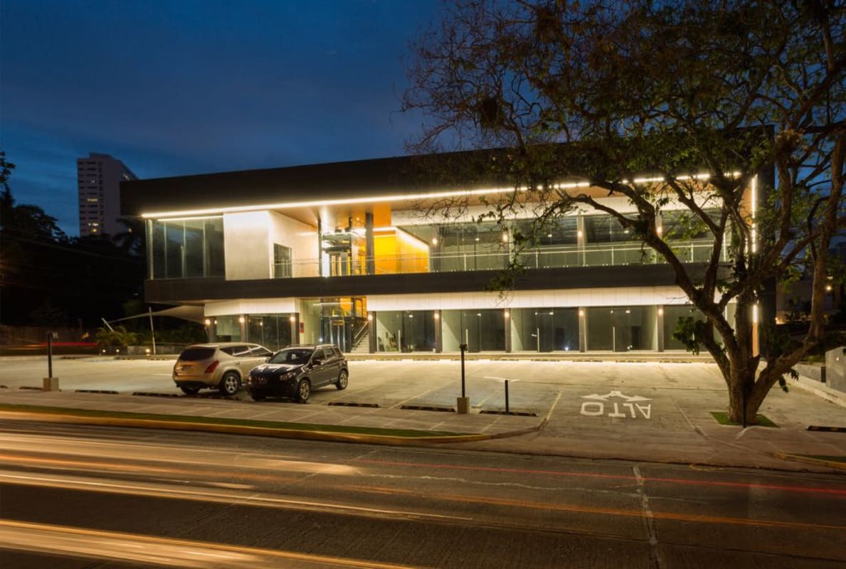 Contemporary illuminated commercial plaza two-story glass facade Plaza Santa Elena Panama City
