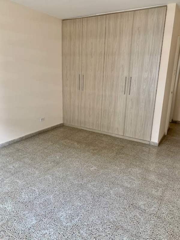 Master bedroom featuring built-in closet split AC and panoramic window PH Terrazas de Obarrio Obarrio Panama