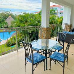 Open concept living dining room modern bright coastal decor beach condo Punta Barco Panama