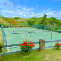 Bright modern guest bedroom balcony view tile flooring Punta Barco Village condo