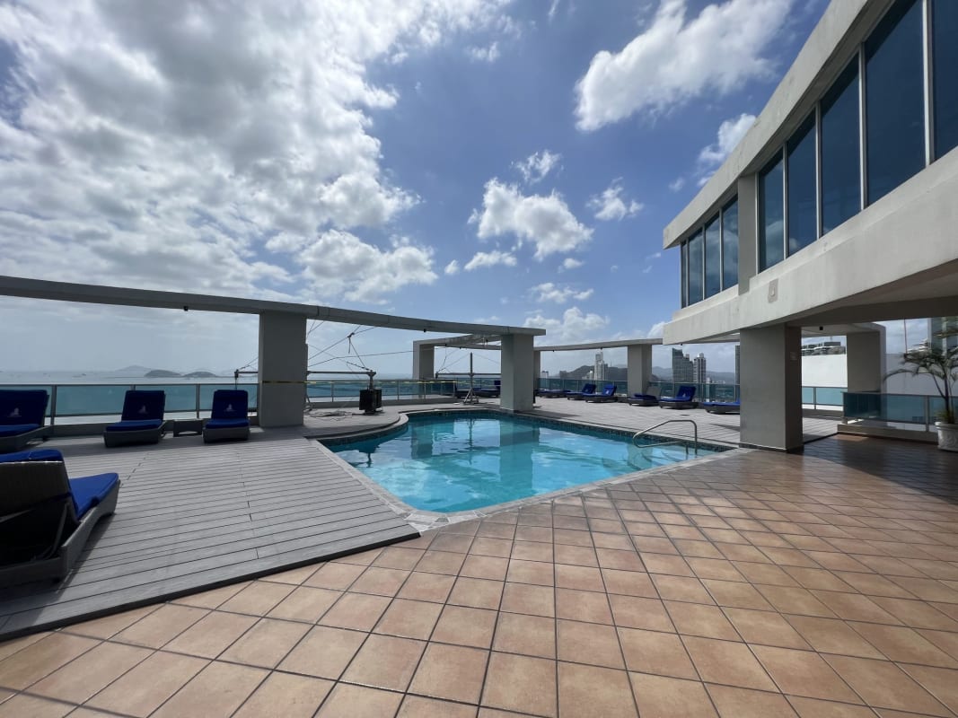 Modern dining room with large windows city skyline and ocean views at PH Grand Bay Panama