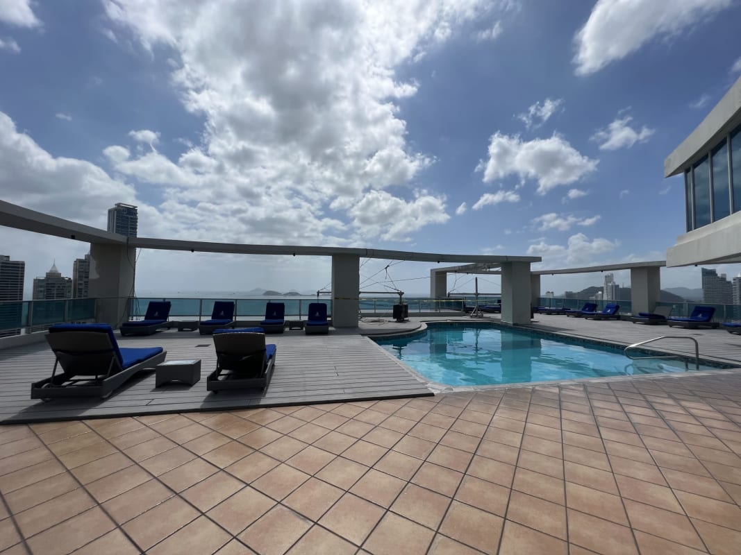 Infinity rooftop swimming pool overlooking city skyline and ocean at PH Grand Bay Avenida Balboa Panama