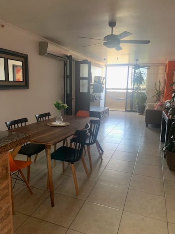 Dining space with ceiling fan adjacent to kitchen in PH Condado Country Club Panama City