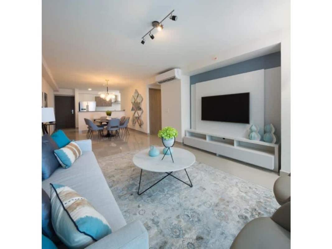 Open-concept apartment living and dining room with large windows in Bella Vista Panama City