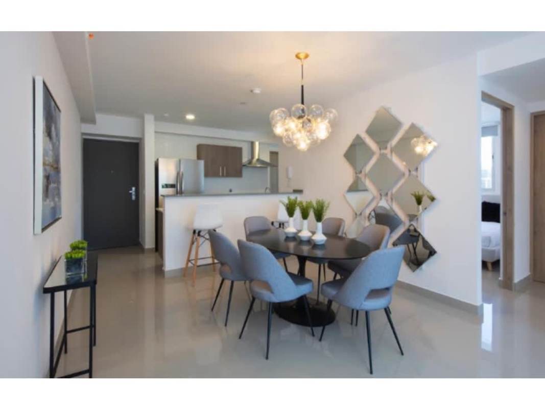 Contemporary round dining table and chandelier in Bella Vista El Cangrejo condo Panama City