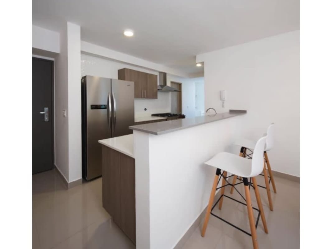 Stainless steel refrigerator and modern breakfast bar in apartment kitchen Bella Vista Panama City