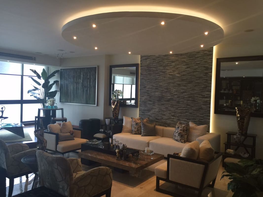 Master bedroom suite with floor-to-ceiling windows and ocean views at PH Panama Bay Costa del Este Panama