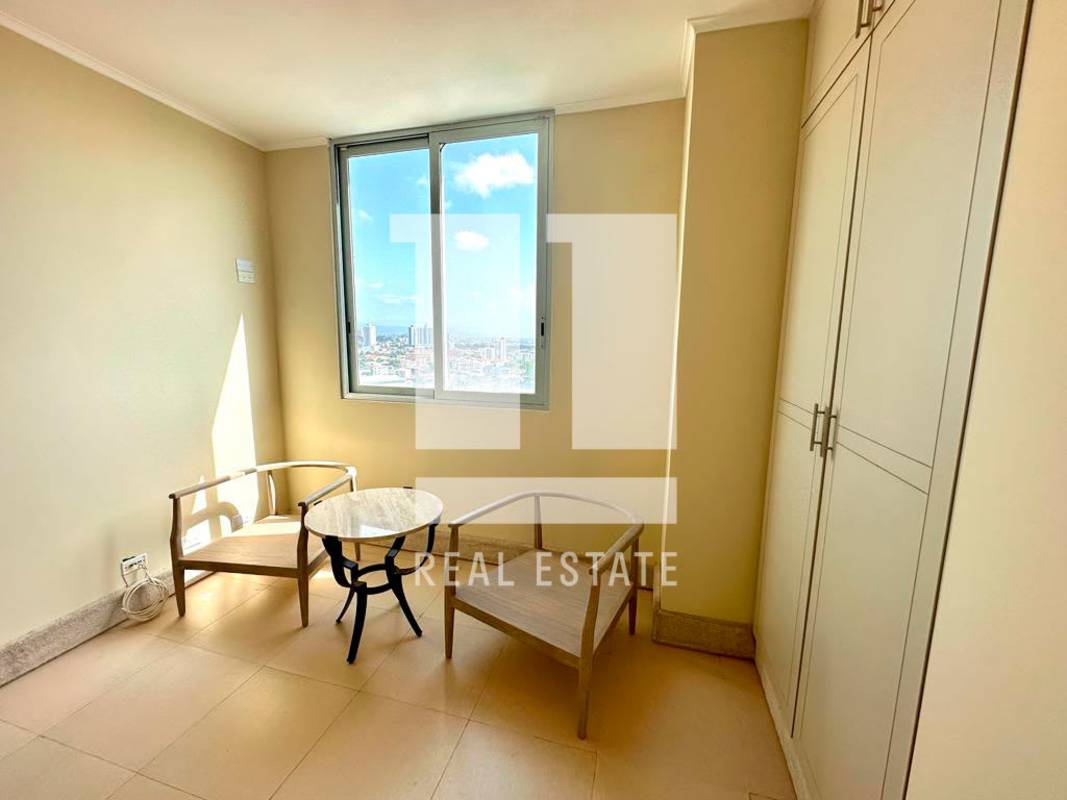 Contemporary bathroom with double sink, marble counter, glass shower in PH Park One Panama