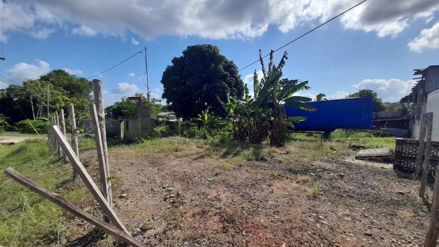 Commercial vacant land plot with partial perimeter wall next to residences in Chepo Panama