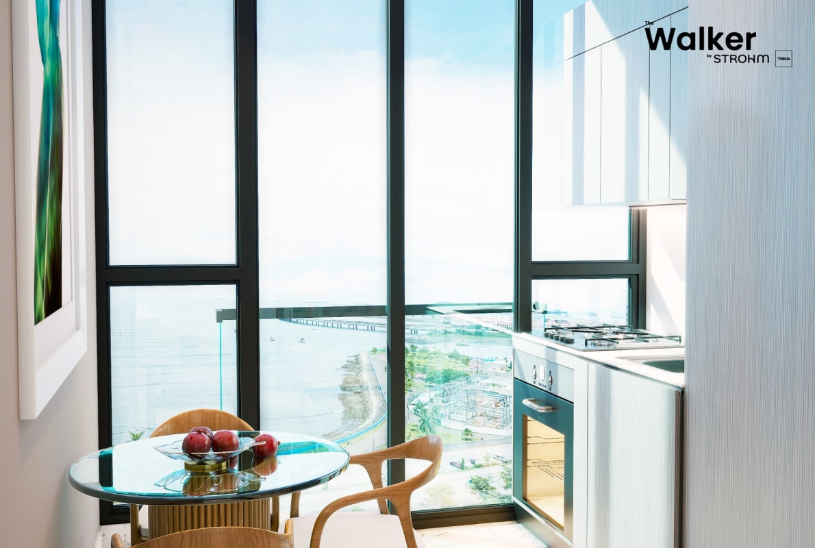 Modern minimalist studio bedroom with panoramic ocean skyline view at The Walker by Strohm Teka