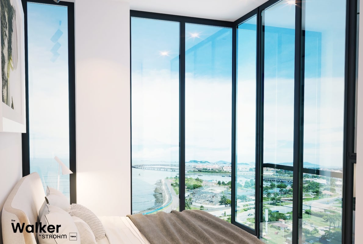 Corner bedroom with panoramic ocean and city skyline views at The Walker Panama