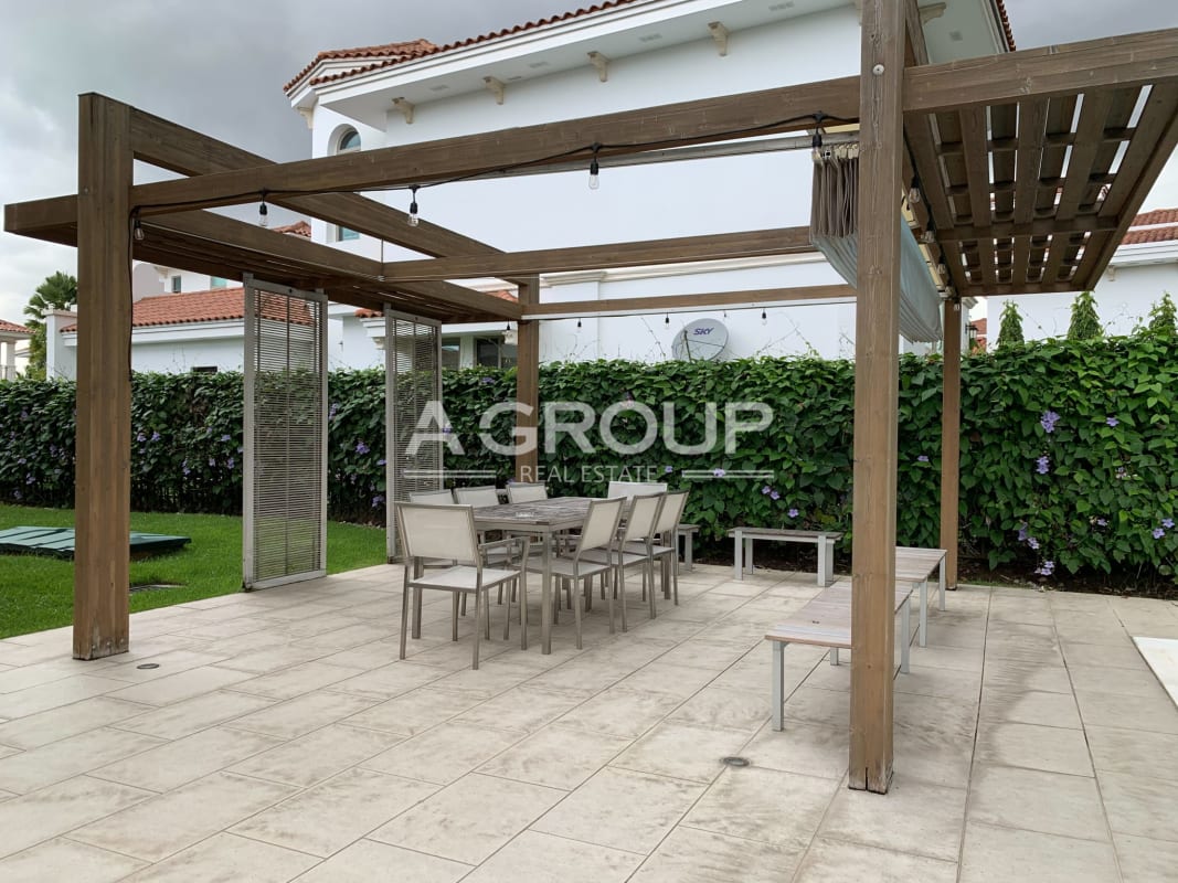 Spacious gourmet kitchen with island, granite countertops, built-in appliances in Santa María Fairway Estates