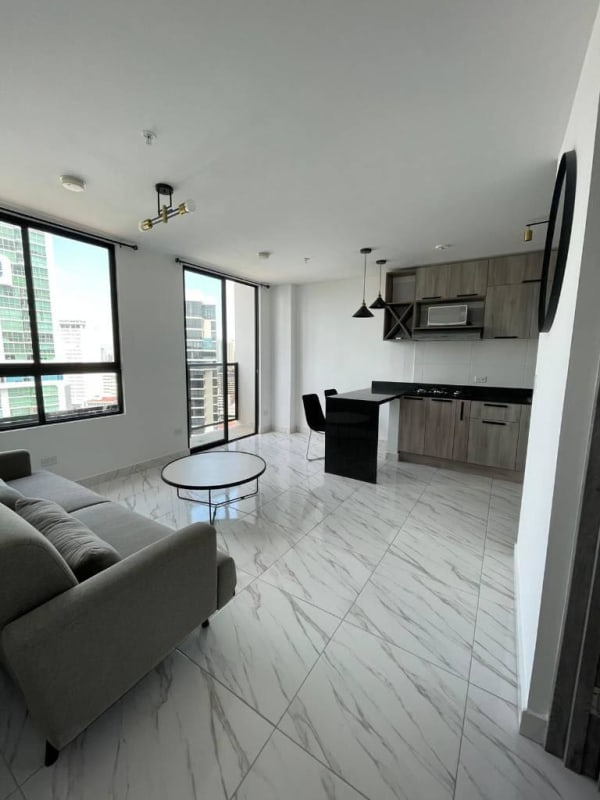 Open-plan living dining area with large windows and balcony PH Dynasty Bella Vista Panama