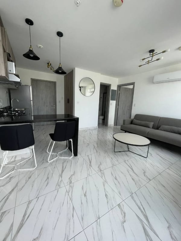 Modern open-plan apartment with marble tile floors and sleek kitchen PH Dynasty downtown Panama