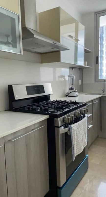 Contemporary kitchen with light cabinets, gas stove, window, at PH Dynasty Panama City