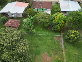 Aerial showing road and flat green land for sale Guararé Los Santos Panama