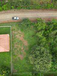 Aerial neighborhood with homes fenced lots greenery in Guararé Los Santos Panama