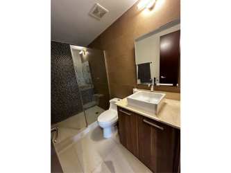 Spacious living room with window, neutral tones, contemporary furniture in PH River Valley Panama Pacifico