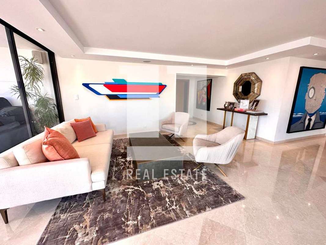 Open plan dining and living room with city skyline view PH El Alcazar La Cresta Panama