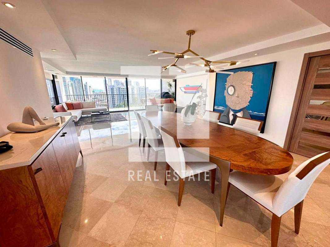 Modern kitchen with marble-topped island and stainless steel appliances PH El Alcazar Panama