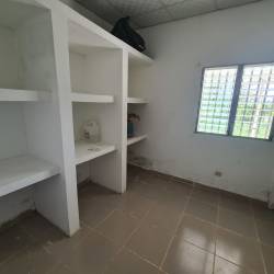 Large fenced backyard garden with grass in residential property El Caño Coclé Panama