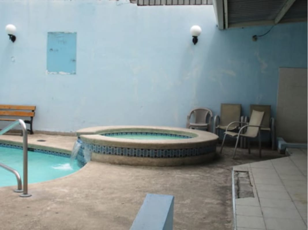 Kids' bedroom with Hot Wheels car bed, playful wall decals, and bright decor PH Park Place Parque Lefevre Panama