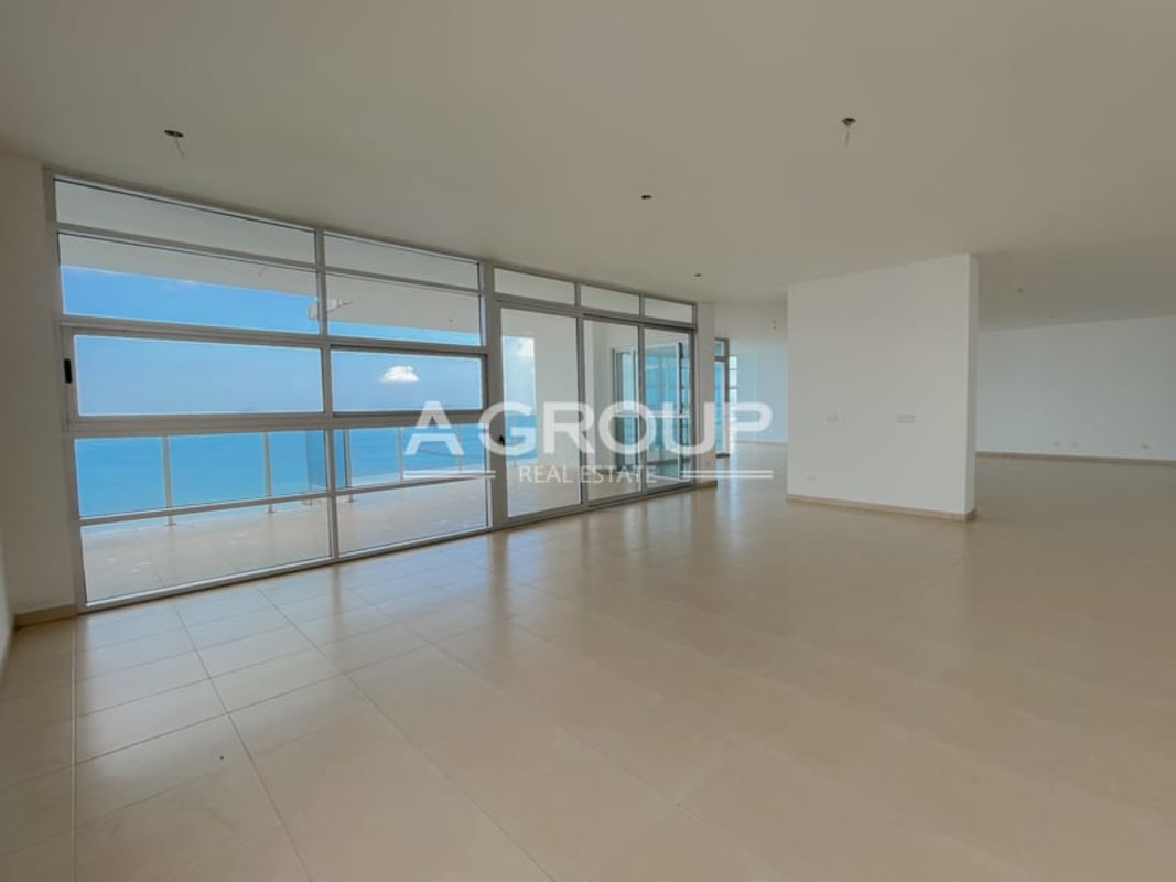 Large wraparound balcony with panoramic ocean and city skyline views from penthouse at PH Waters on the Bay Panama City