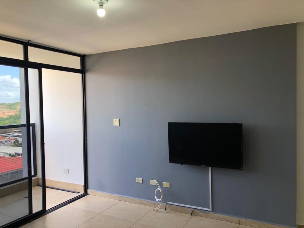 Living room with balcony access and city skyline views PH Terrazas del Rey Condado del Rey Panama