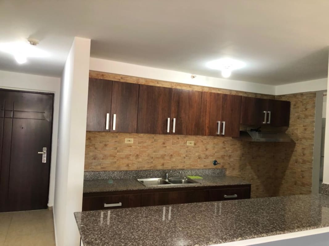 Contemporary kitchen with granite counters, wood cabinets PH Terrazas del Rey Condado del Rey Panama