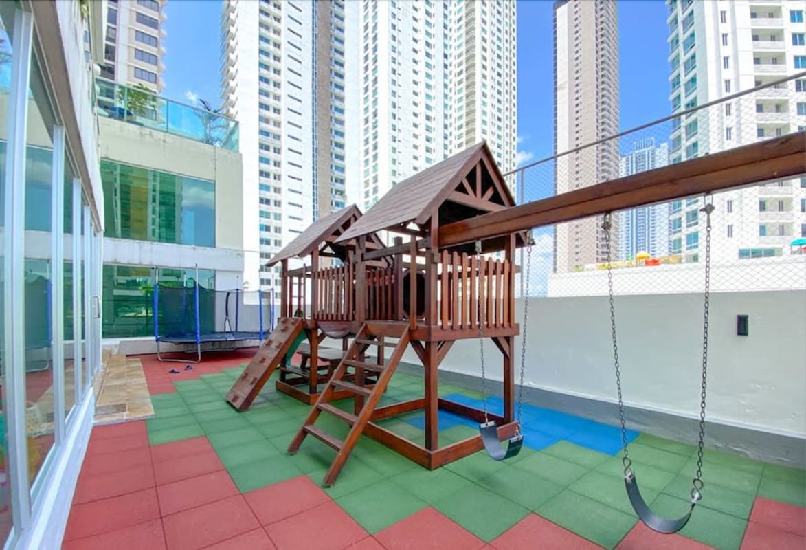 Elegant master bedroom, upholstered bed, floor to ceiling windows with ocean view in PH Lumiere Costa del Este Panama