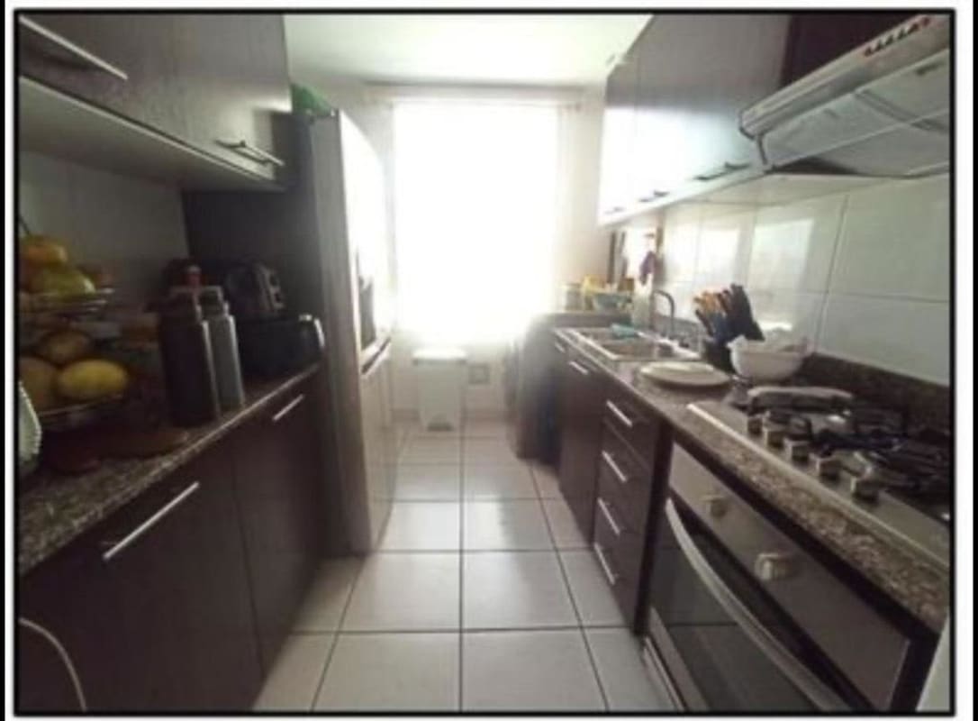 Living room with mounted TV, large windows, tiled floors in PH Lefevre 75 apartment Panama