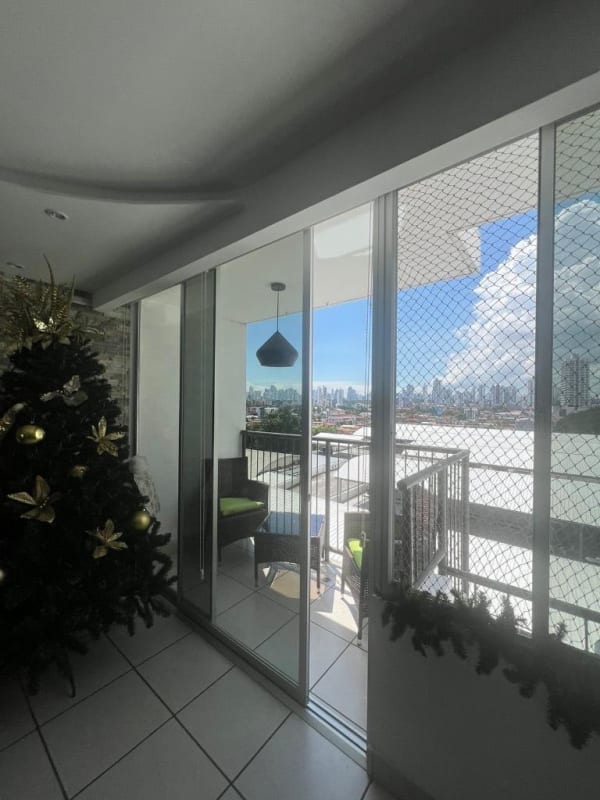 Interior with sliding doors to balcony and skyline view PH Lefevre 75