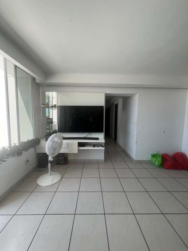 Galley kitchen with granite top, gas stove, dark cabinetry in PH Lefevre 75 Panama