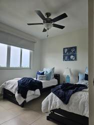 Guest bedroom with twin beds, AC, daylight at Bijao Beach Resort Rodman Panama