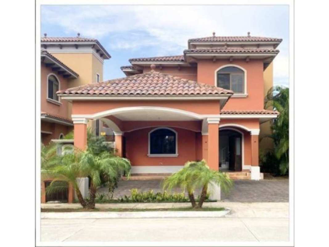 Bright open living room with tiled floor, tall windows, air conditioning unit, modern staircase in Costa Sur Panama