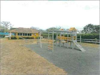Children’s playground with swing sets and climbing equipment in Quebradas de Cabuya Chame