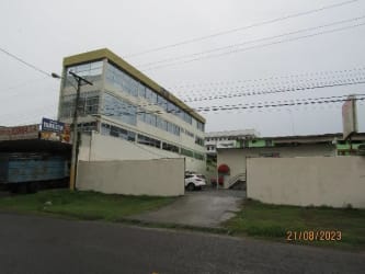 Bright tiled living room inside apartment in multi-level building downtown Chitre Panama