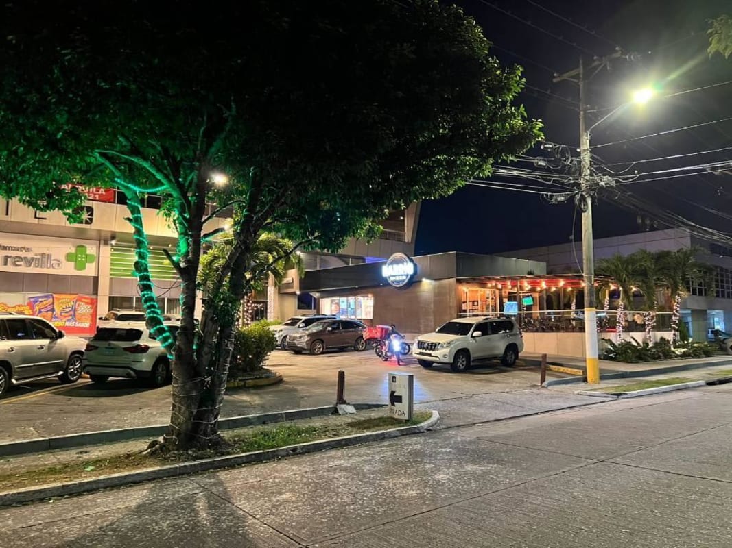 Exterior parking lot with retail stores, restaurant, pharmacy in Altos Plaza commercial center Condado del Rey Panama City