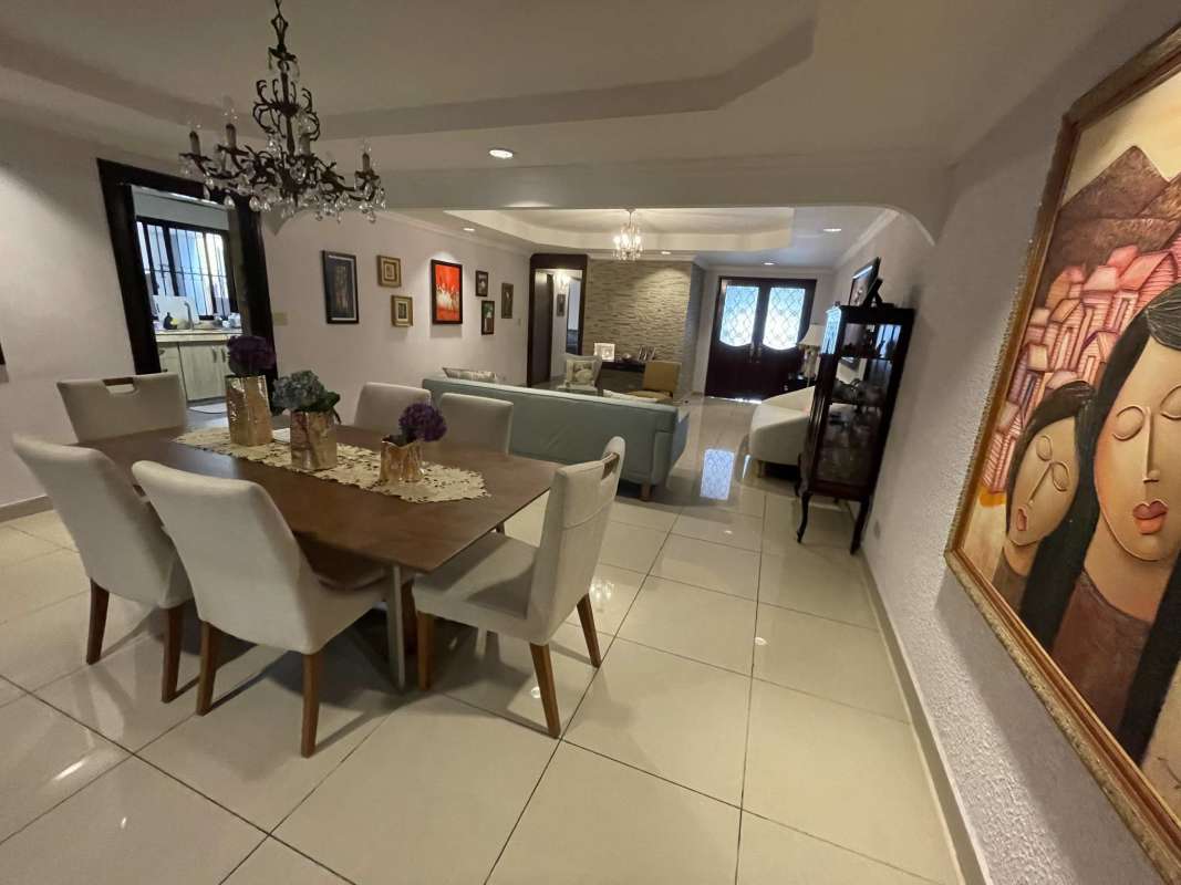 Open living and dining room with decorative ceiling in Hato Pintado house Panama