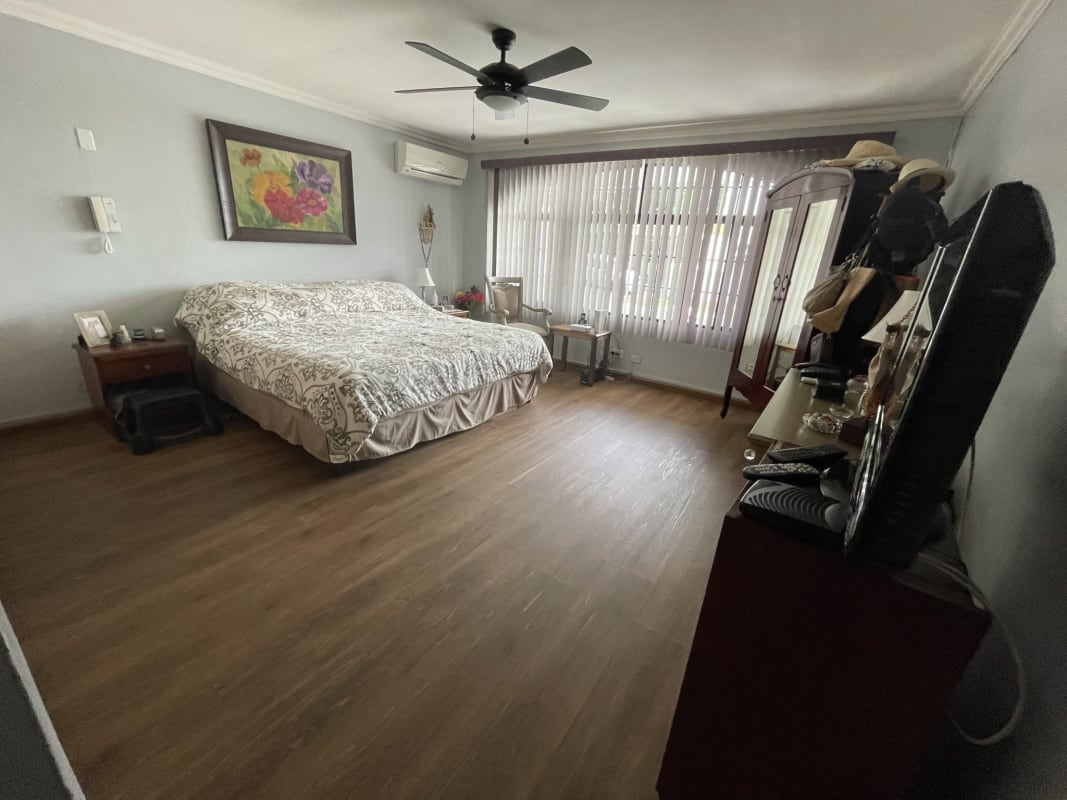 Family room with sliding glass doors to terrace in Panama City house