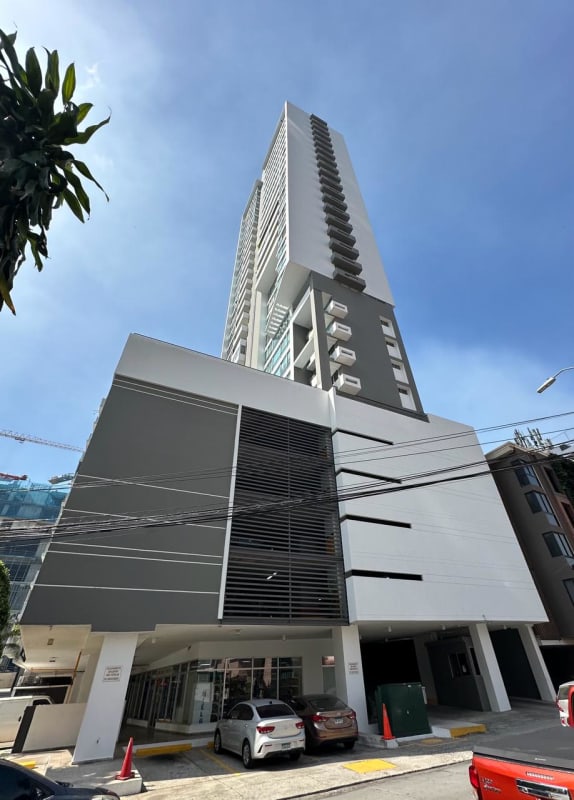 Spacious living area with panoramic windows showcasing bay views in PH South Beach, Avenida Balboa Panama City