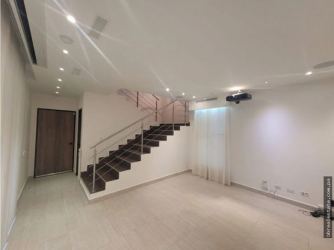 Modern living area with staircase and projector PH Nativa Panama Pacifico