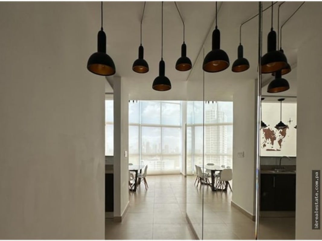 Dining area floor-to-ceiling windows city view PH Park Loft San Francisco Panama