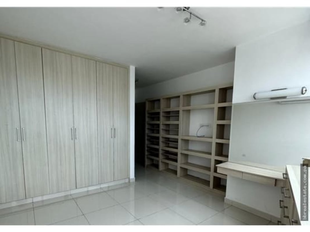 Walk-in closet with custom cabinetry PH Park Loft Panama