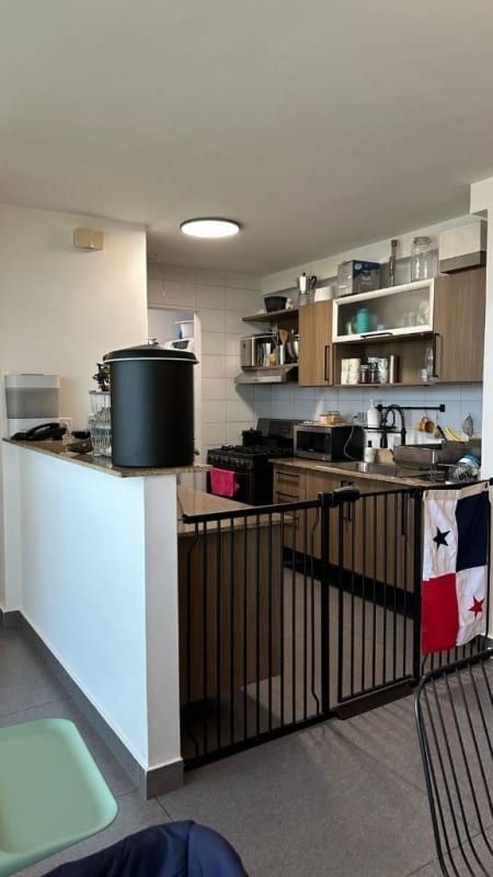 Contemporary kitchen with wood cabinets, open shelves, modern appliances Kings Park Tower 200 Panama City