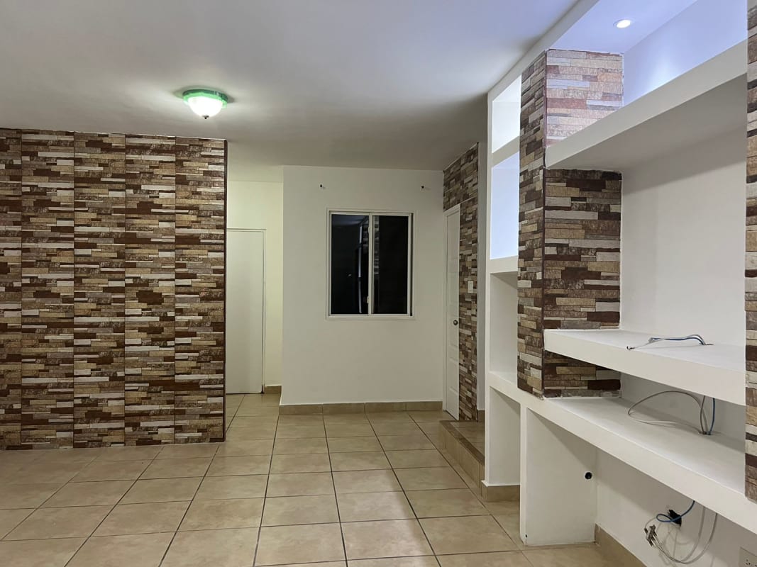 Living room built-in entertainment center stone columns PH Alpes Panama