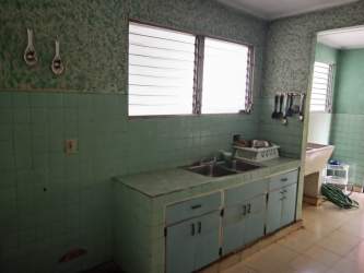 Vintage Kitchen with mint green ceramic tile and dual sink commercial house La Villa de Los Santos