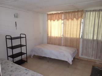 Bedroom with tile floor, wardrobe and natural light La Villa de Los Santos