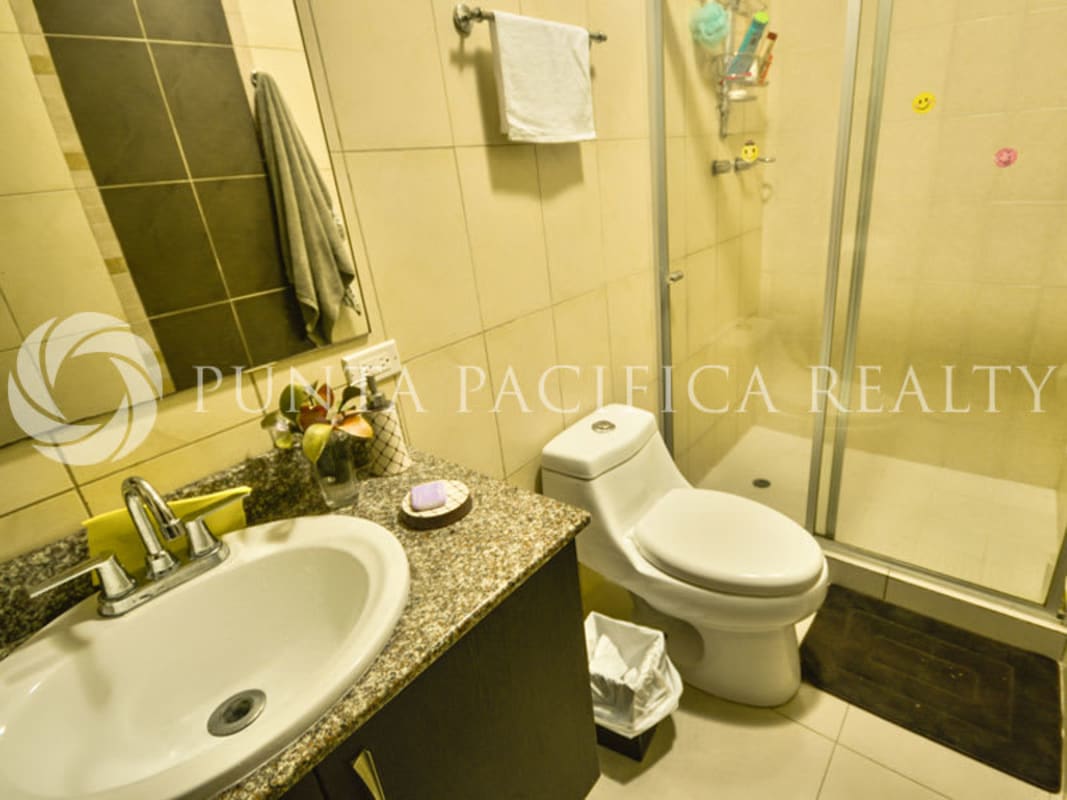 Contemporary bathroom with glass shower and granite counters in Coco del Mar Serenity on the Bay Panama